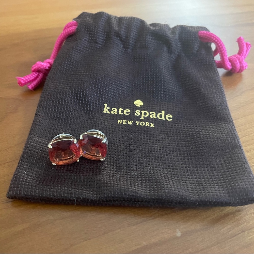 Kate Spade Stud Earrings in gold with a pinky/orange colored stone
